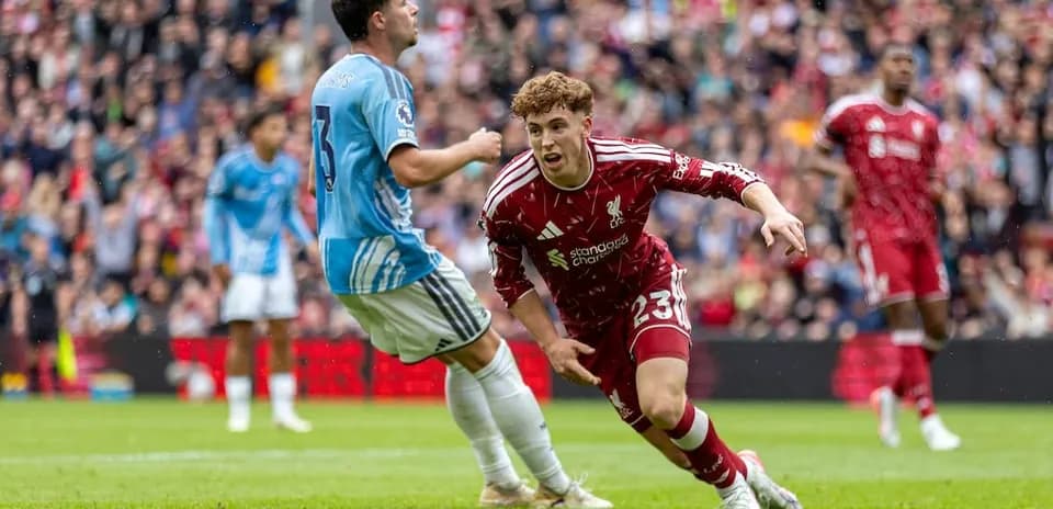 Liverpool player chasing the ball against Nottingham