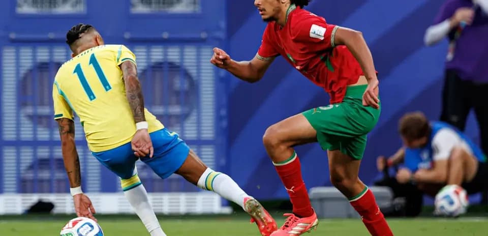Player dribbling past opponent during match
