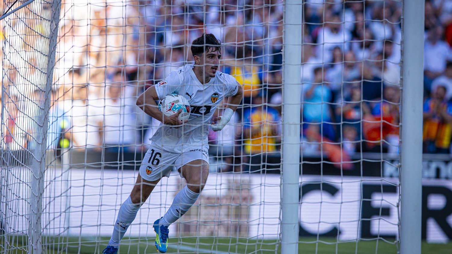 Valencia goalkeeper celebrating with the ball