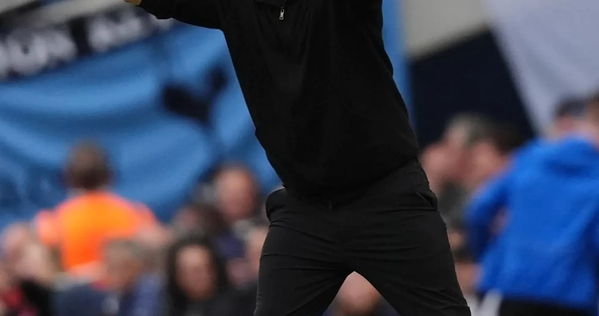 Coach gesturing during match on the sideline