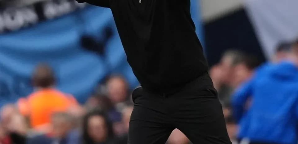 Coach gesturing during match on the sideline