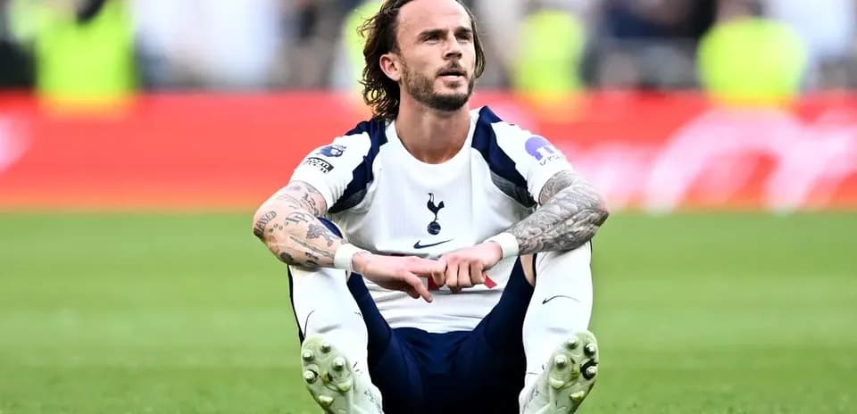 Player sitting on the pitch after the match