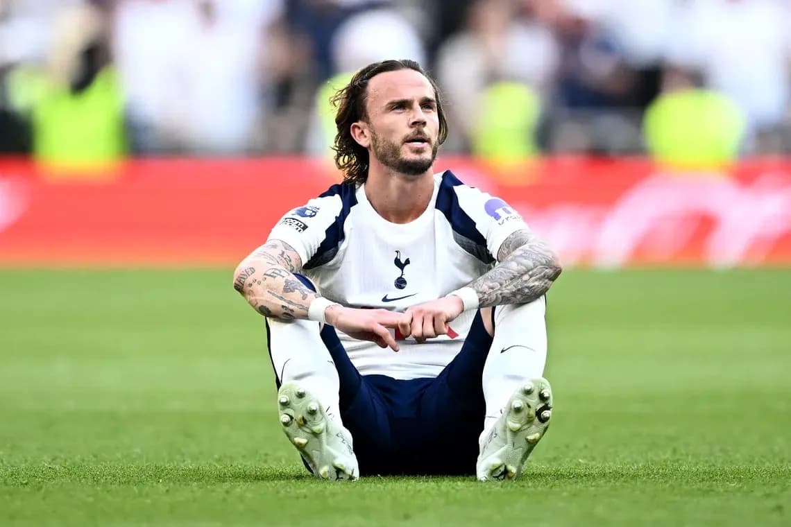 Player sitting on the pitch after the match