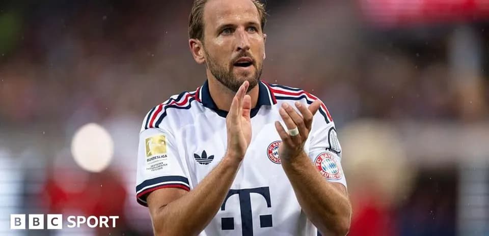 Player applauding fans wearing Bayern Munich jersey