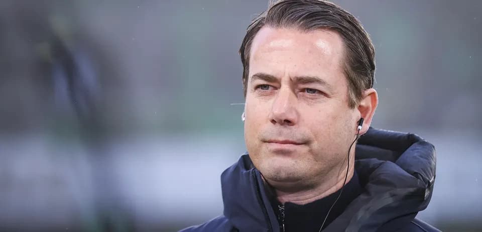 Coach wearing headphones during match preparation