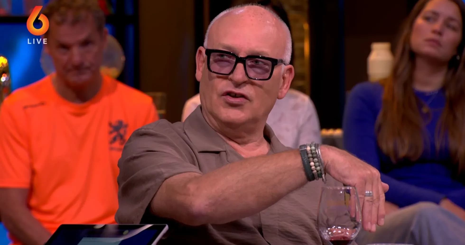 Person speaking during a talk show with audience