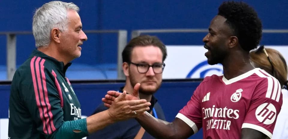 Coach and player shaking hands during event