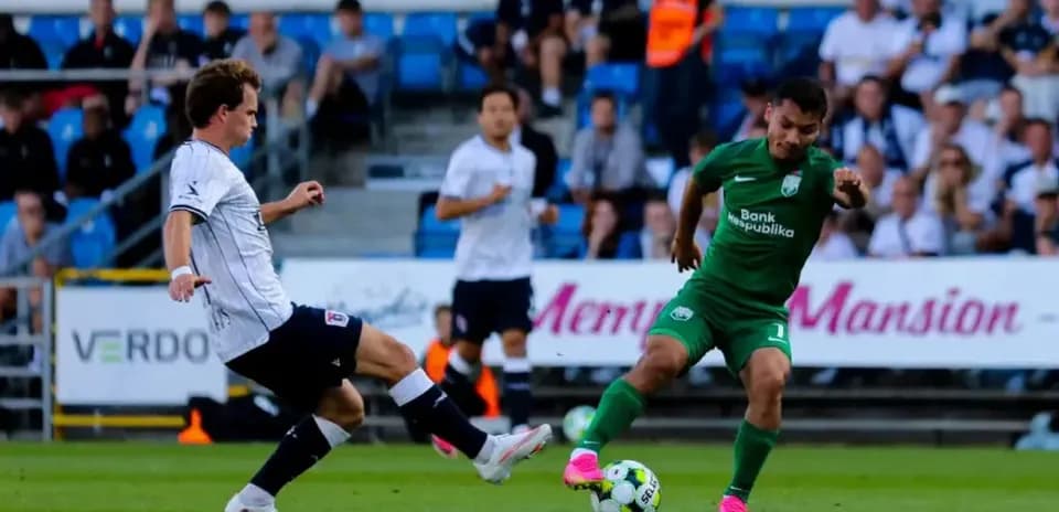 Aarhus player tackling Sabah FA opponent