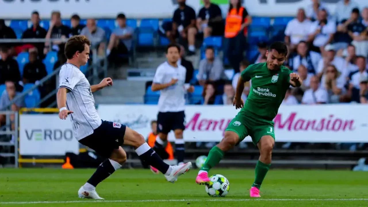 Aarhus player tackling Sabah FA opponent