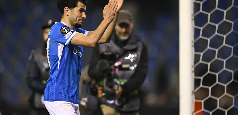 Player applauding fans after match conclusion
