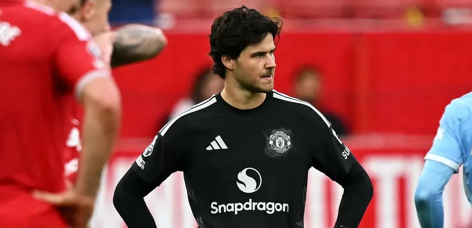 Goalkeeper in black jersey during match action