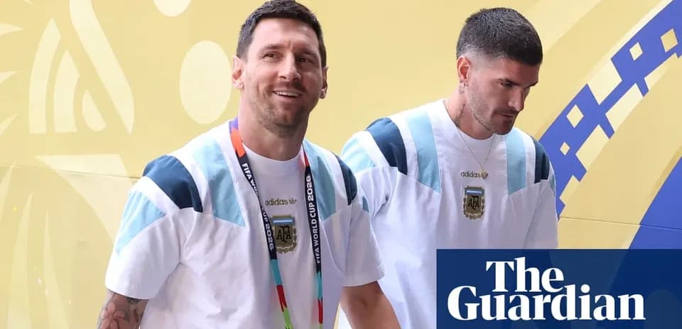 Two players walking in Argentina team attire