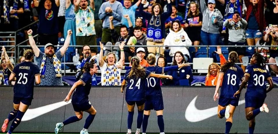 Players celebrating a goal during match