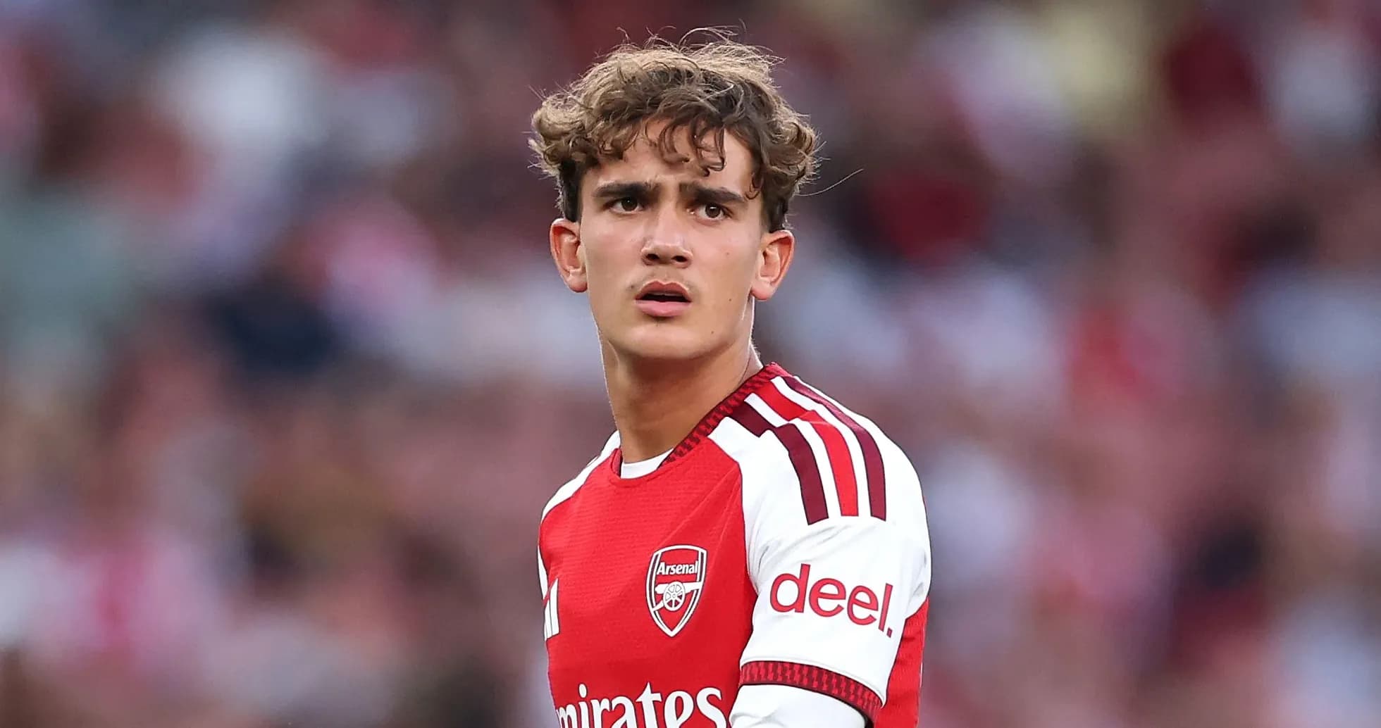Player in Arsenal kit during match action