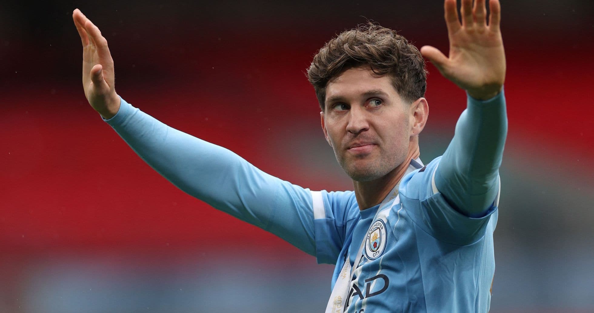 Player waving to fans during match celebration