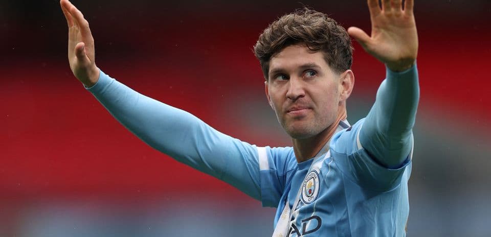 Player waving to fans during match celebration