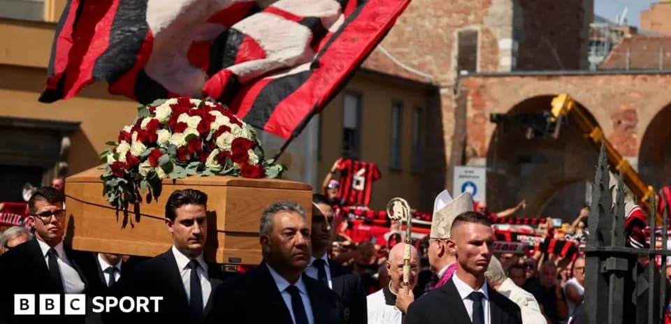 Funeral procession with coffin and supporters waving flags