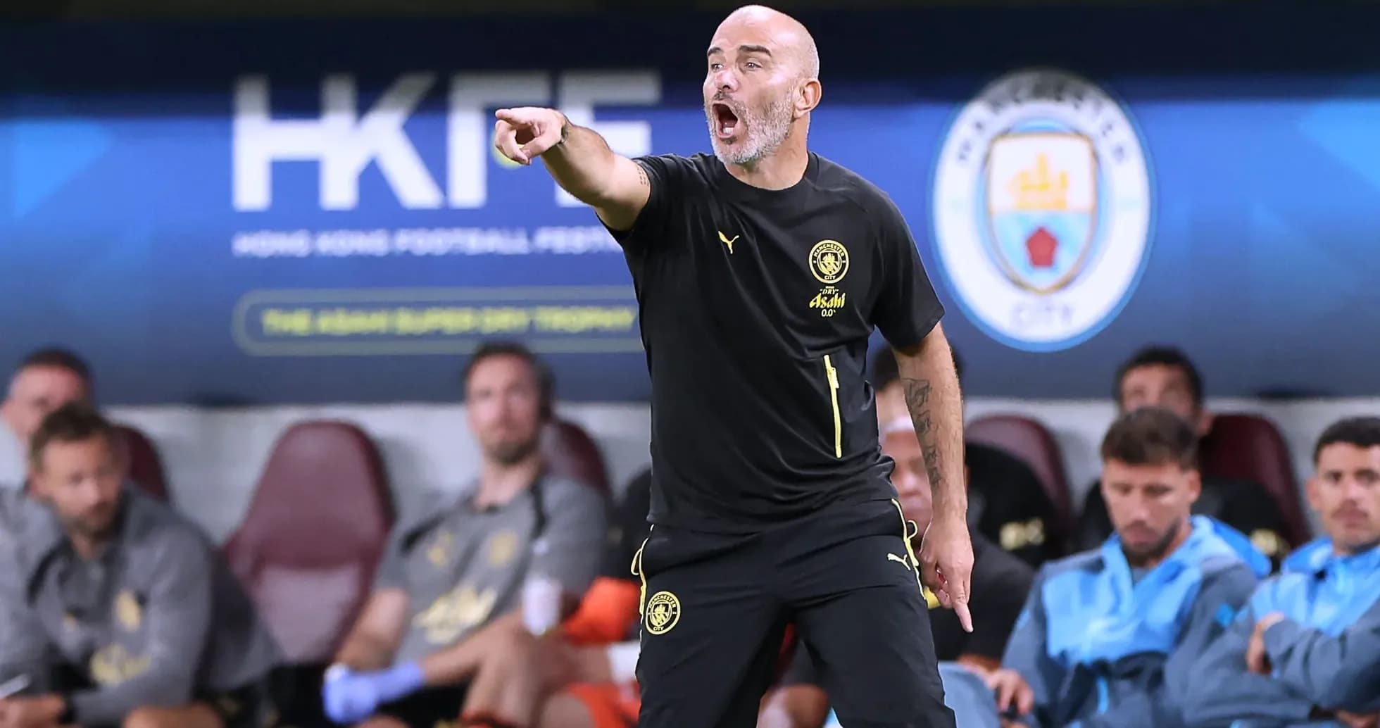 Coach giving instructions from the sidelines during match