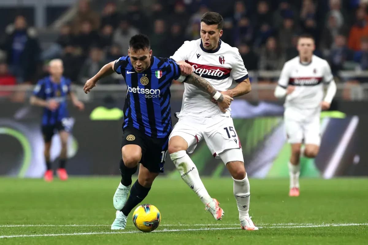 Lautaro Martinez and player battling for possession