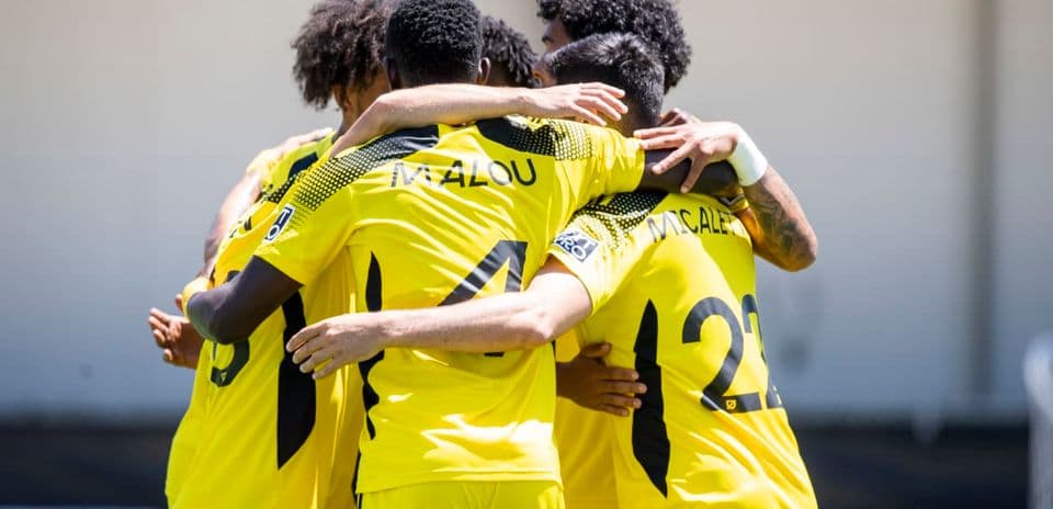 Columbus Crew II players celebrating a goal