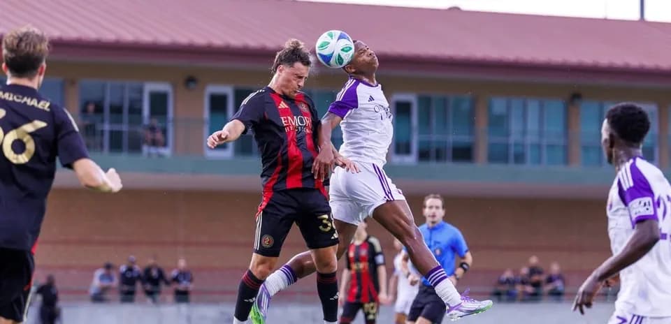 Players contesting for the ball during match