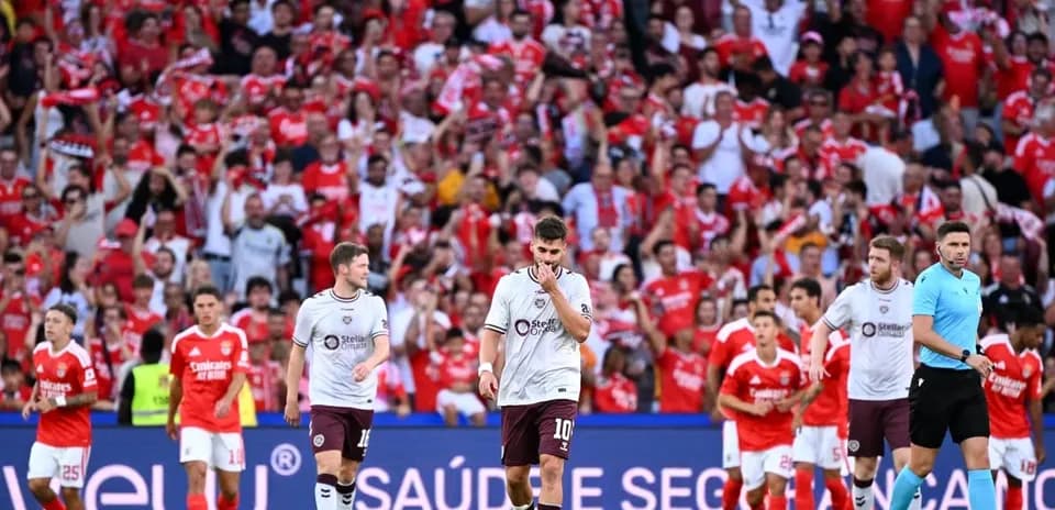 Hearts players walking off the pitch after defeat