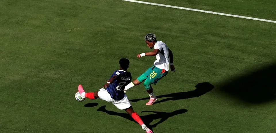 Player attempting to evade a sliding tackle during match