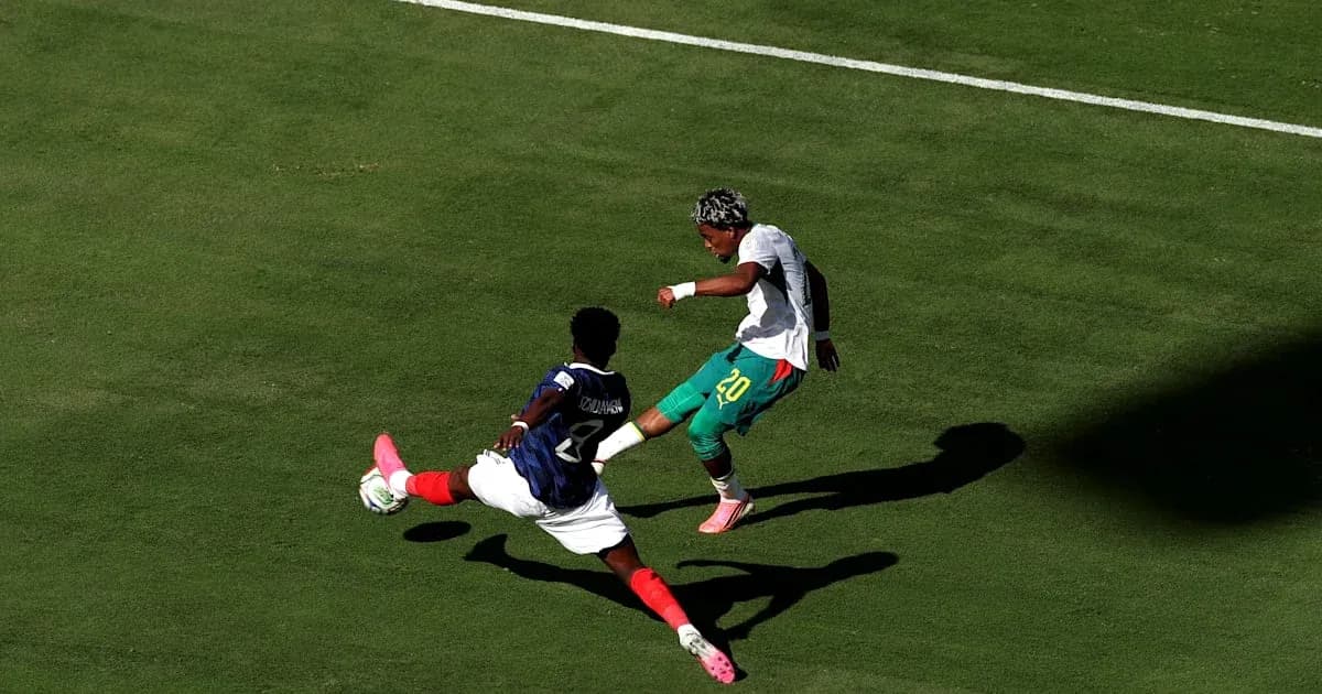 Player attempting to evade a sliding tackle during match
