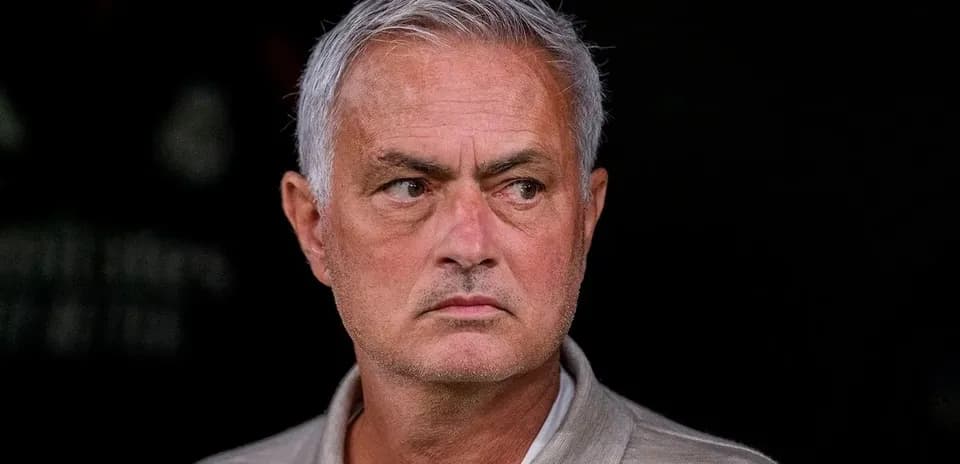 Football manager observing from the sidelines