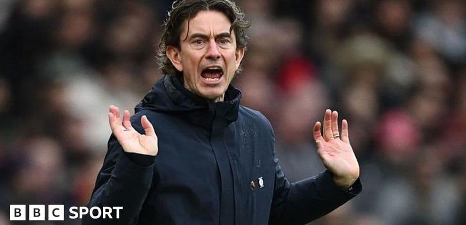 Manager gesturing during a football match
