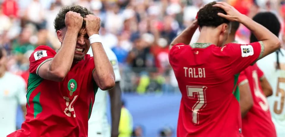 Moroccan players reacting to a missed opportunity