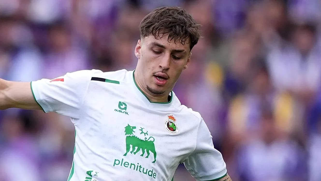Player in white jersey controlling the ball during match
