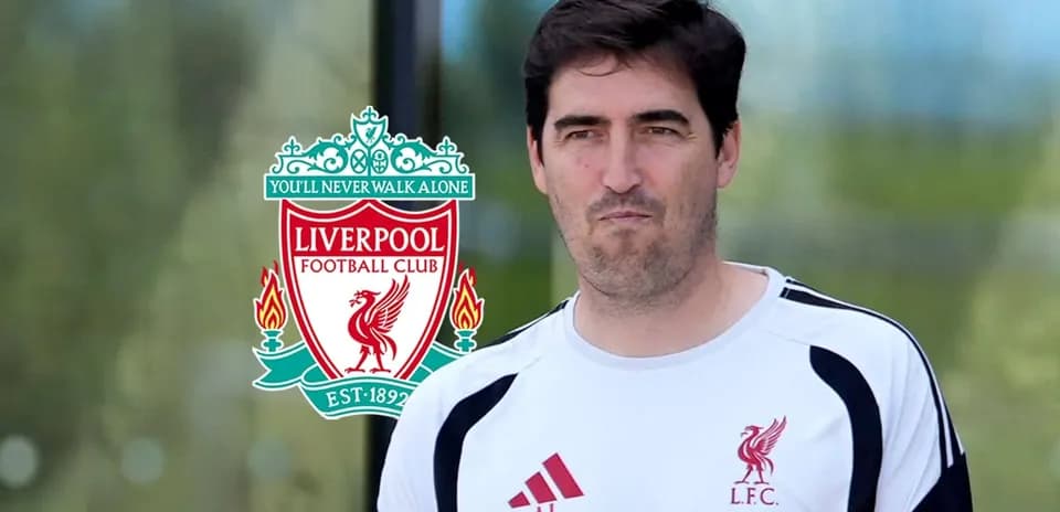 Coach in Liverpool FC training gear with club logo