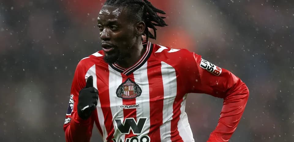 Player running in Sunderland FC kit during match