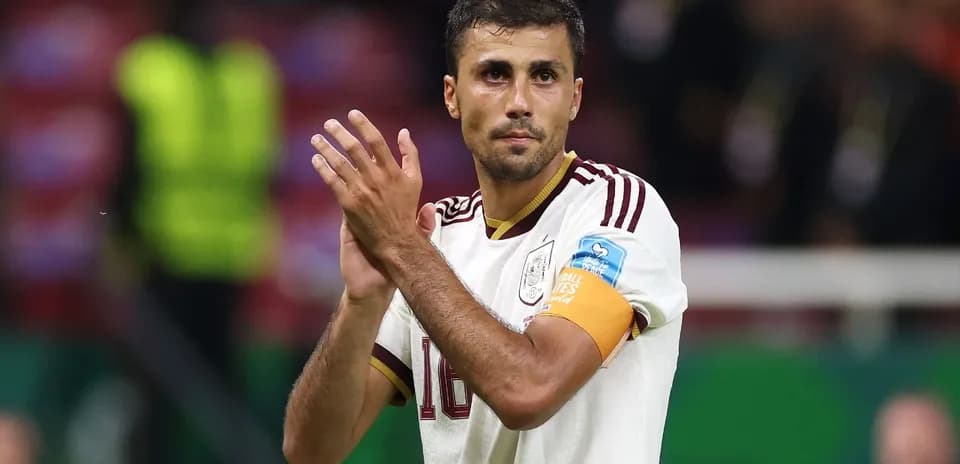 Player applauding fans after a match