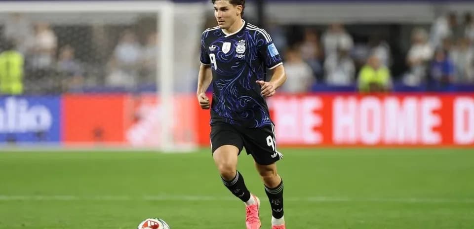 Player in Argentina kit running on the field