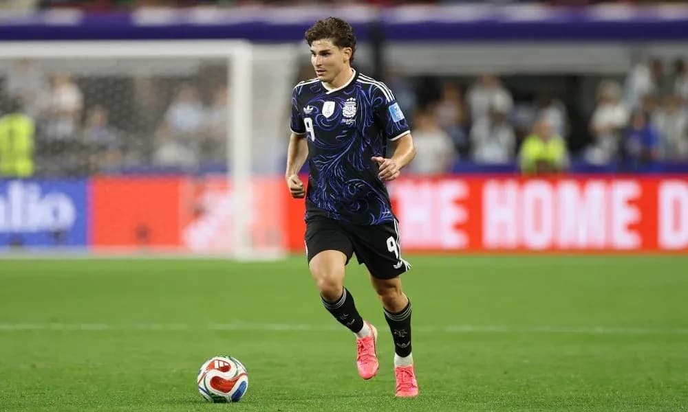Player in Argentina kit running on the field
