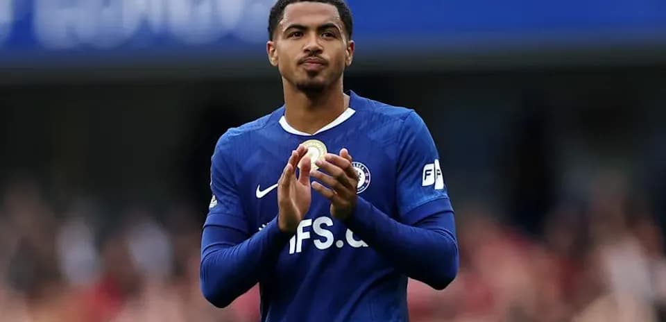 Player applauding fans in blue team kit