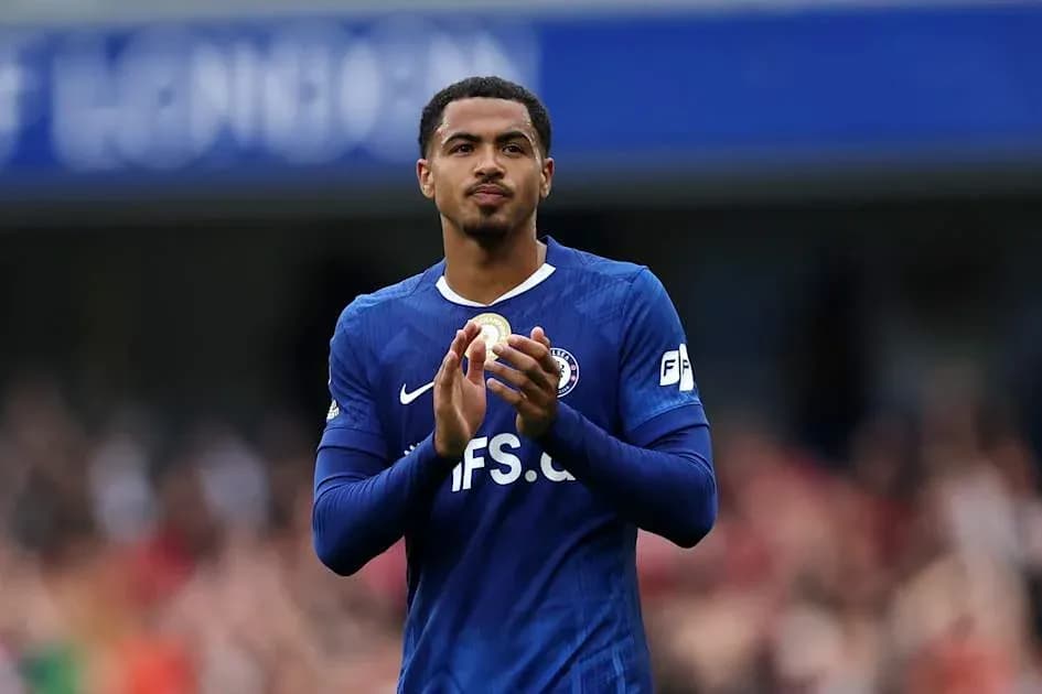 Player applauding fans in blue team kit