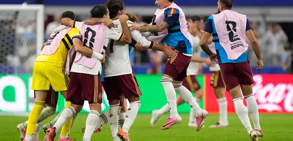 Spain players celebrating after scoring a goal