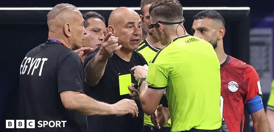Coach discussing with referee during match dispute
