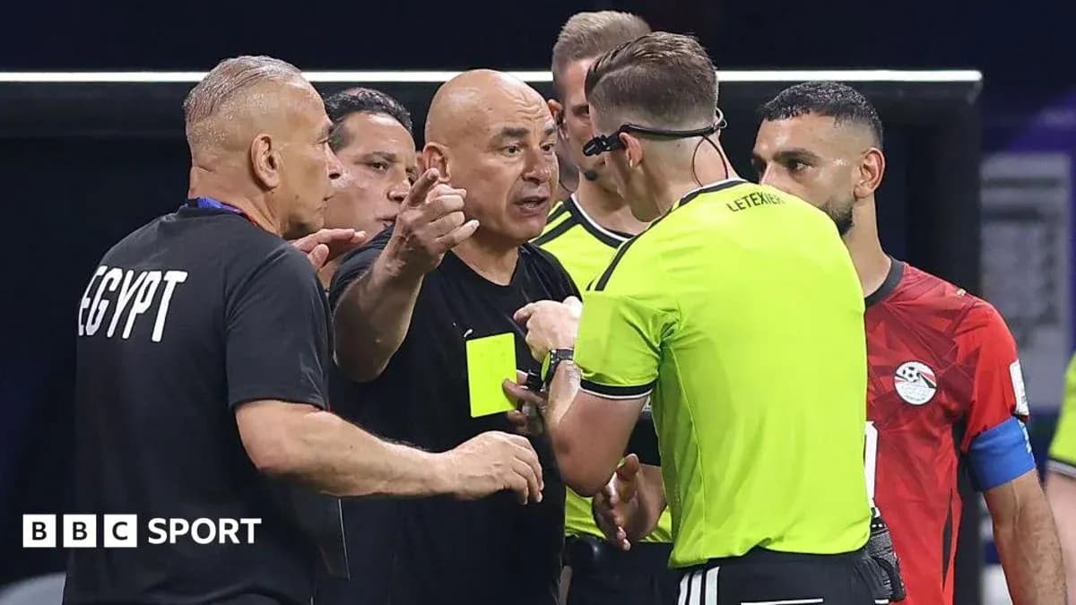 Coach discussing with referee during match dispute