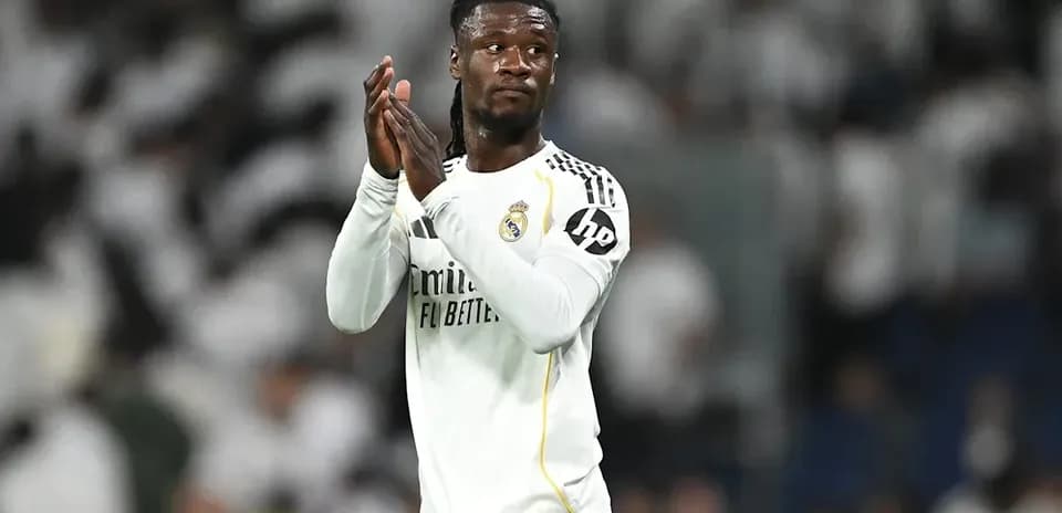 Player applauding fans during match at stadium