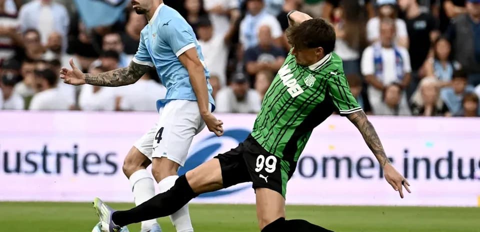 Two players contesting the ball during match action
