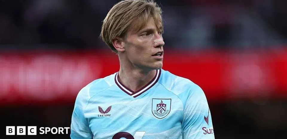 Burnley player wearing light blue jersey during match