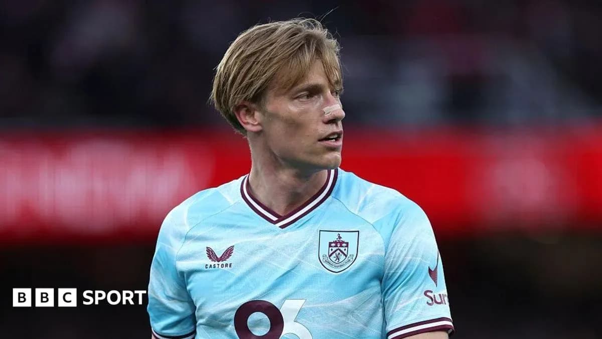 Burnley player wearing light blue jersey during match
