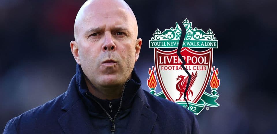 Person in front of Liverpool FC logo