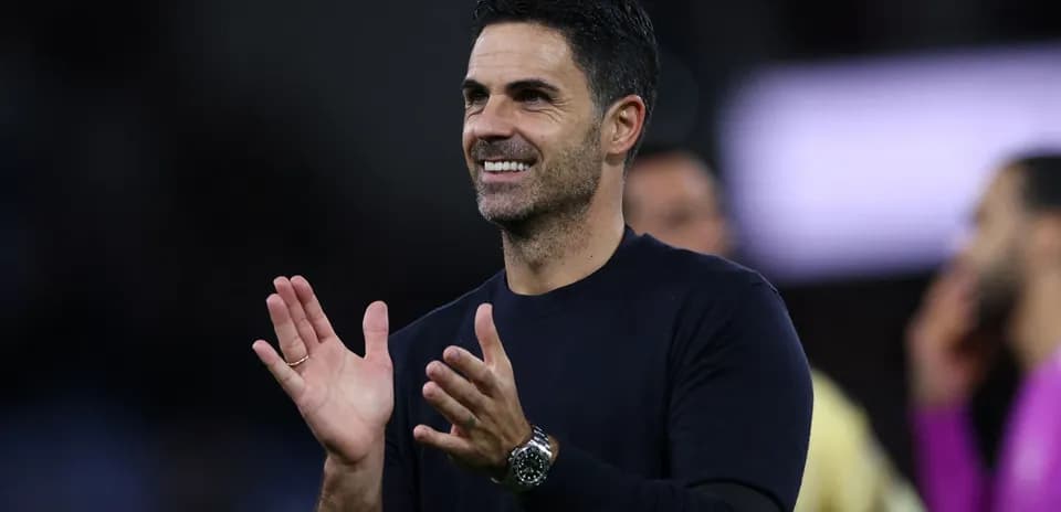 Coach applauding during match on the sidelines