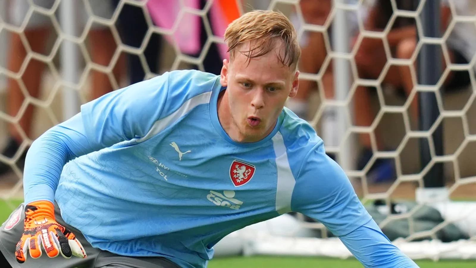Goalkeeper diving to make a save during training
