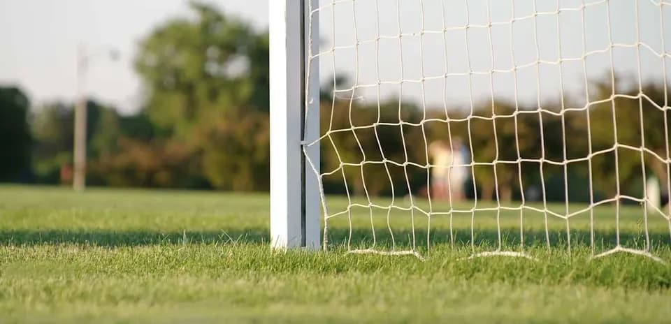 Close-up of soccer goalpost and net